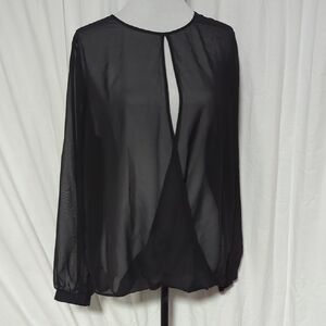 Jennifer Lopez Black Blouse with Sheer Elegance